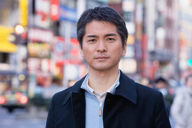 a portrait of an asian man