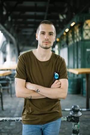 a serious young man posing outdoors