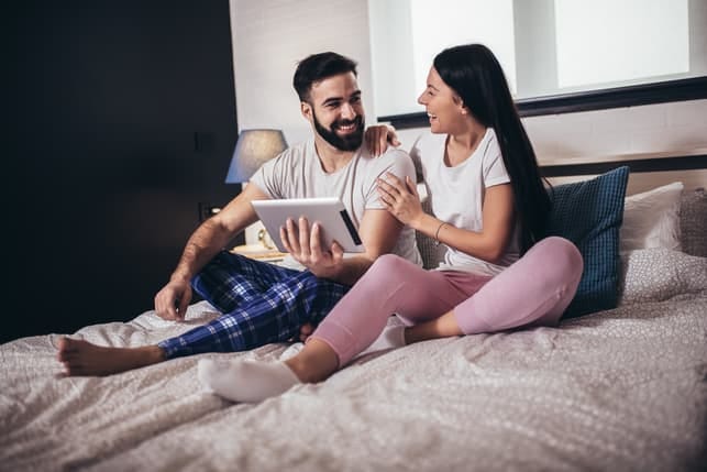 a couple using a tablet together
