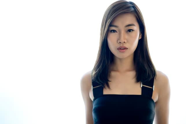 a portrait of a beautiful asian woman posing indoors