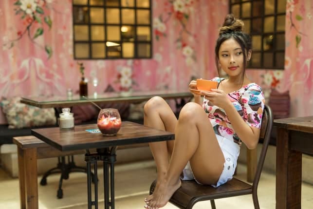 an asian girl with a traditional hairstyle is sitting