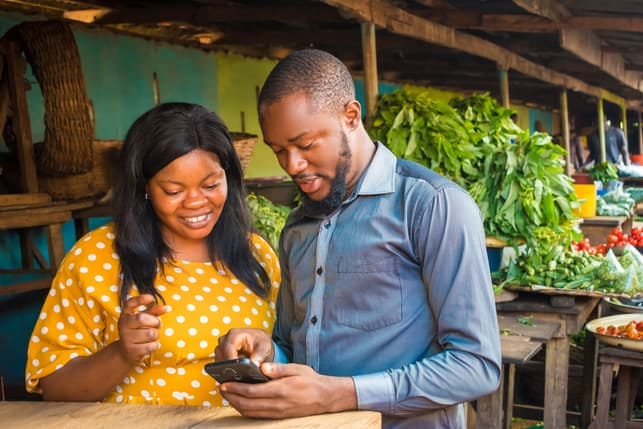an african couple is using a dating app